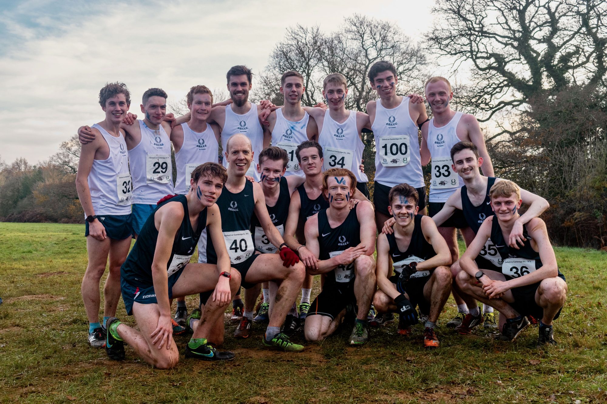 Oxford’s Tortoises and Snails together after their II–IVs races, with blue warpaint on their faces