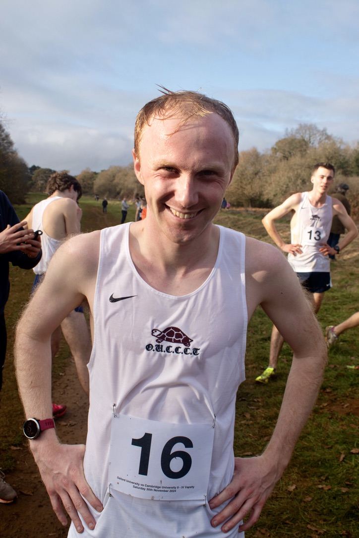 An Oxford runner, number 16, smiling after the 2024 race