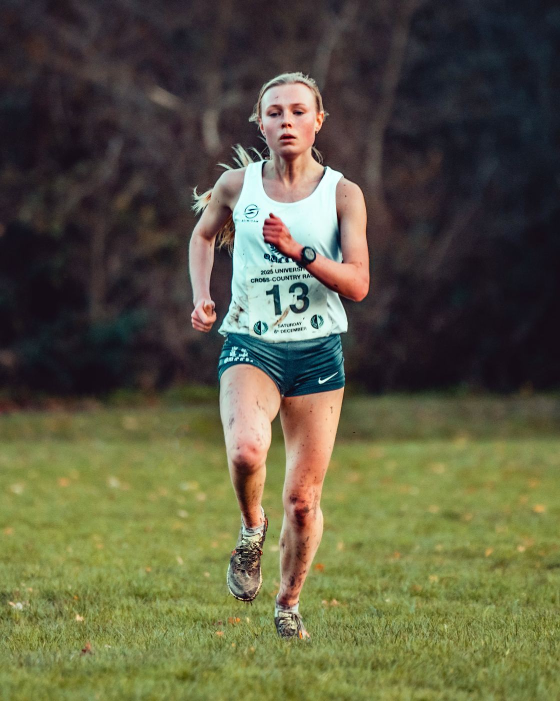 A Ladies’ runner, number 13, racing across the grass